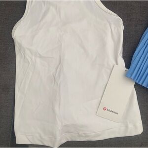 LuluLemon Racer back top and pleated skirt. New with tags. Size 4.